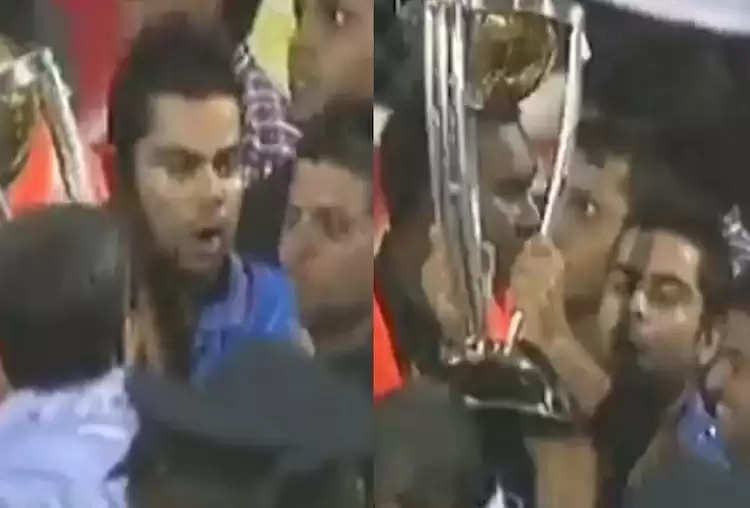 Virat-Kohli-and-Suresh-Raina-hitting-old-man-with-World-Cup